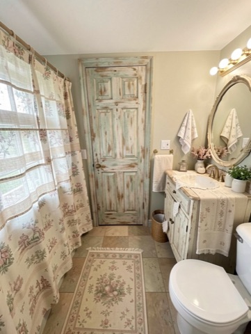 Bathroom (round mirror) — French Country